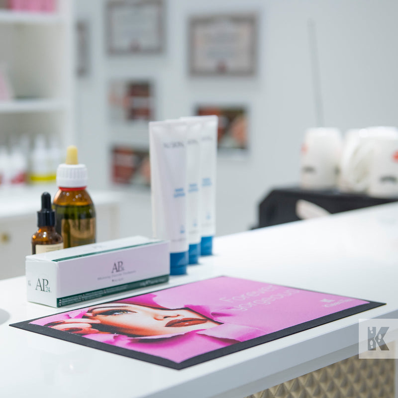 Pink printed counter mat in a beauty salon