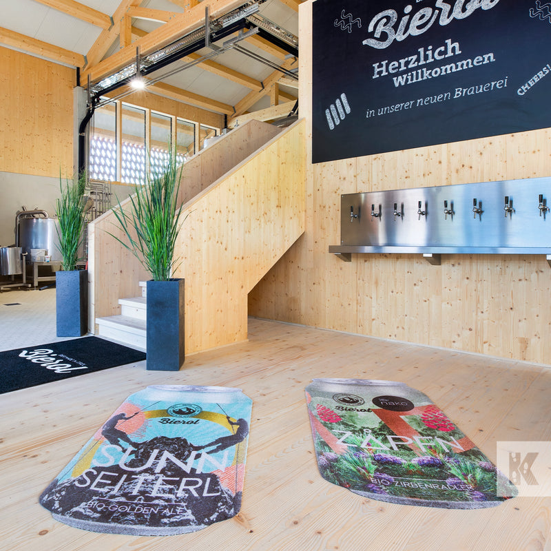 Bierol brewery pine wood floor and walls with beer taps and printed can shaped mats