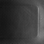 A close-up of a black, rubber anti-fatigue mat with a textured surface.