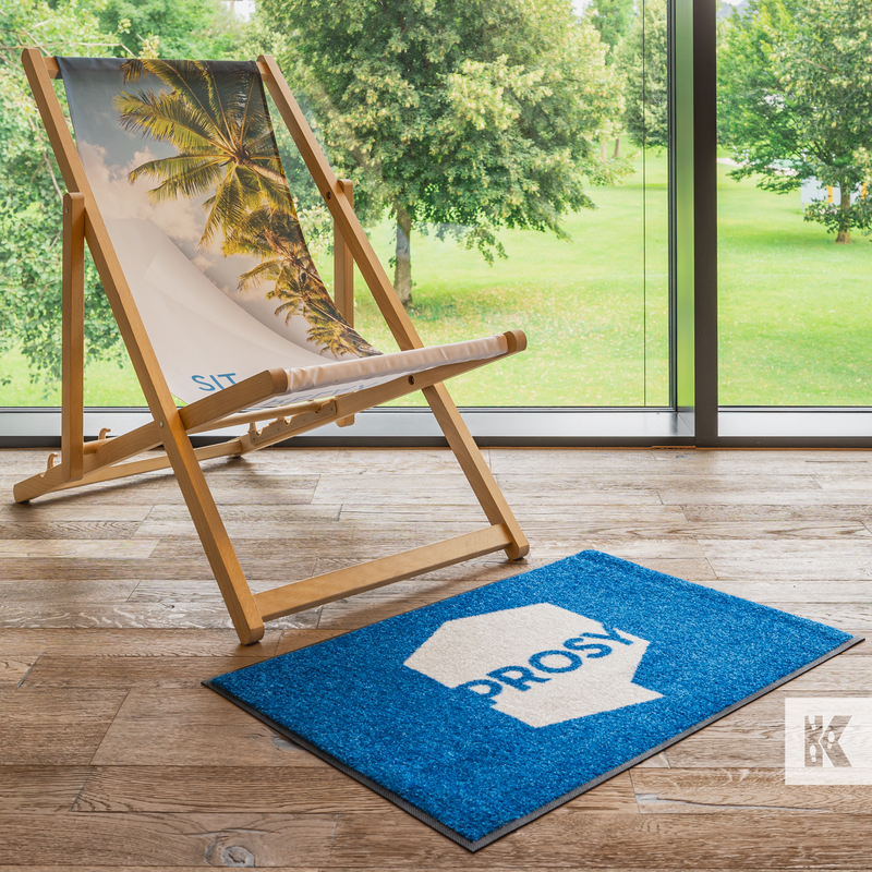 Prosy brand on a logo mat in front of a deckchair