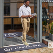 Havwoods door mats with smart young man walking out into the street