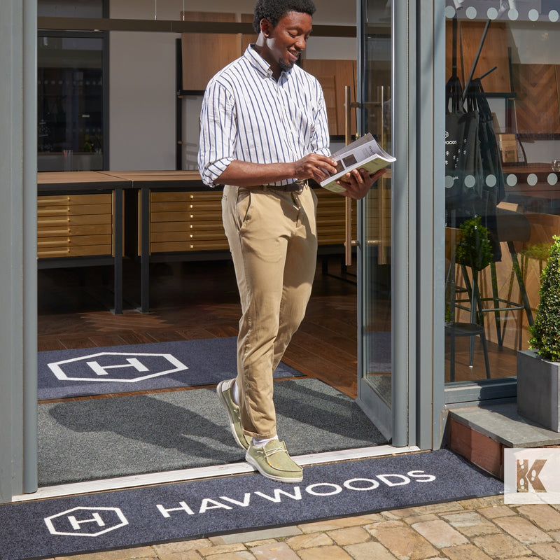 Havwoods door mats with smart young man walking out into the street