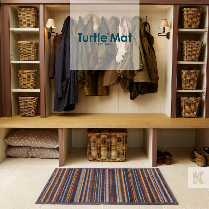 Turtle Mat coloured stripes in front of a hallway shelf system