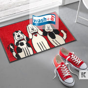 Red sneakers with white laces and a red, black and white printed mat with cute dog cartoon